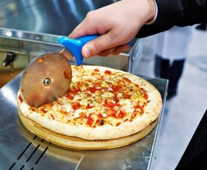 cutting a pizza cutting a pizza